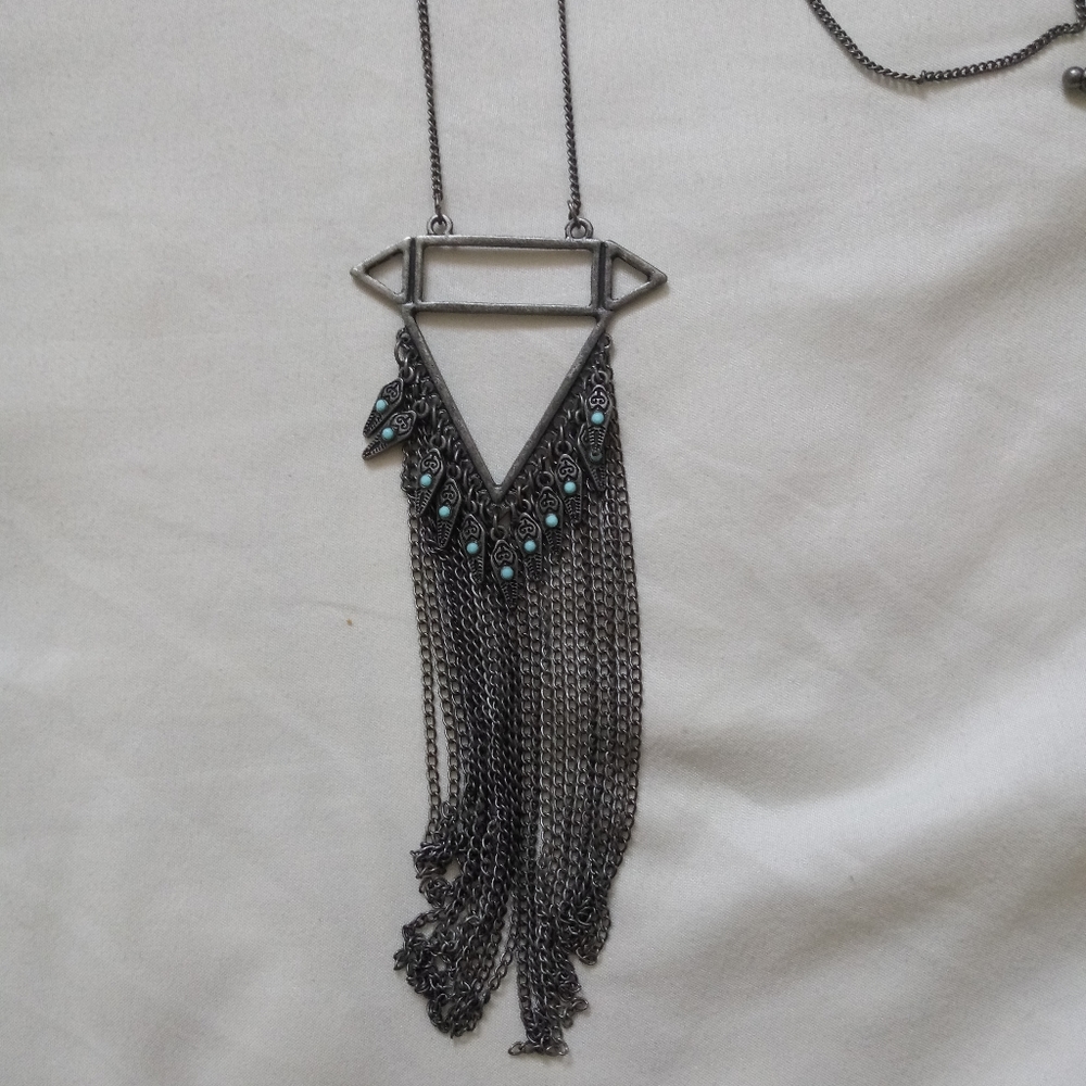Silver necklace with blue accent on long chain